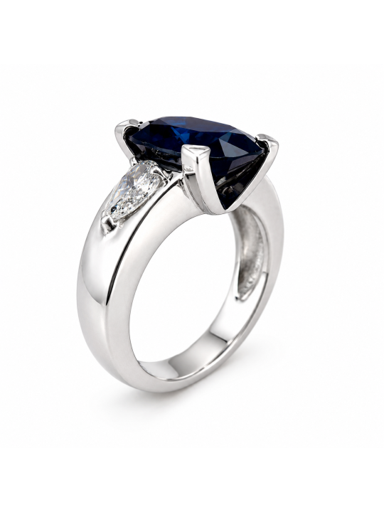 Bague monture moderne en or blanc 750/1000ème composée d'un saphir ovale de 6.62 carats et de deux diamants poires