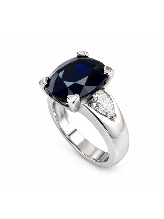 Bague monture moderne en or blanc 750/1000ème composée d'un saphir ovale de 6.62 carats et de deux diamants poires